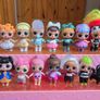A lot of L.O.L. Surprise dolls with accessories and a doll podium. Image 2
