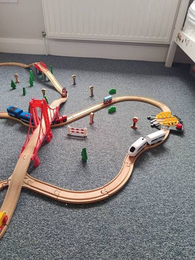 Wooden train set with 5 vehicles and turnstile