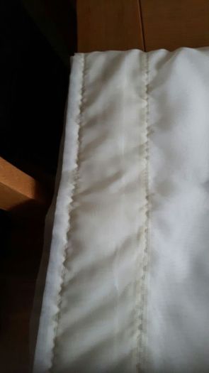 Cream/ivory voille curtains.