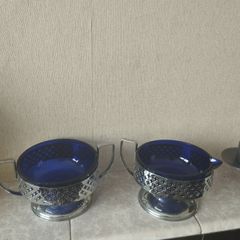 Vintage cobalt blue glass milk jug and sugar bowl with chrome baskets.