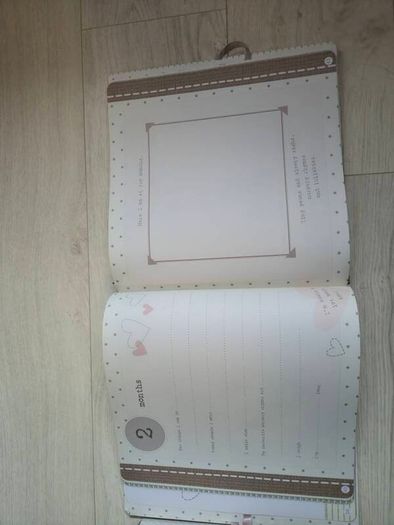 Baby record book and silver rattle
