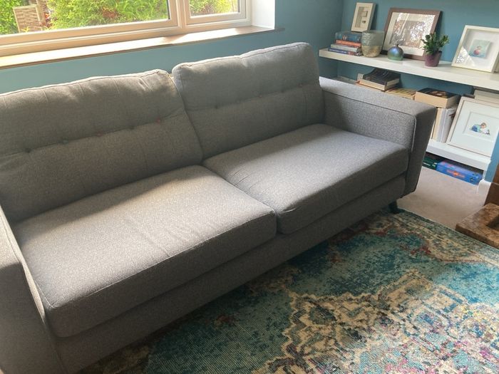 Grey DFS sofa and matching footstool