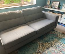 Grey DFS sofa and matching footstool