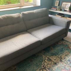 Grey DFS sofa and matching footstool