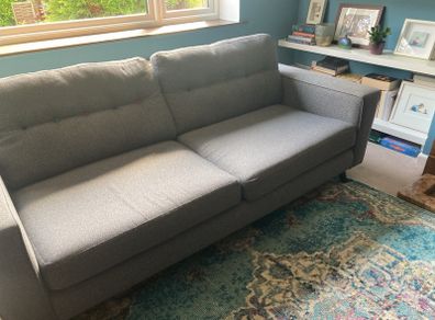 Grey DFS sofa and matching footstool