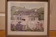 Country Cottage With Cat On Wall Outside
