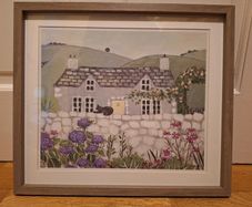 Country Cottage With Cat On Wall Outside