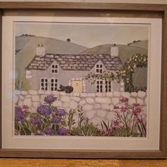 Country Cottage With Cat On Wall Outside