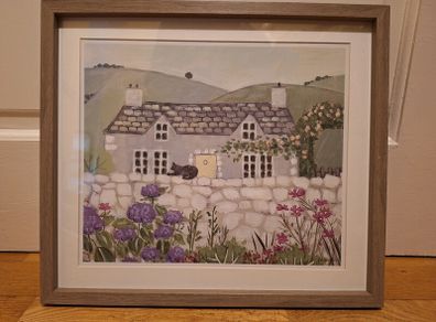 Country Cottage With Cat On Wall Outside