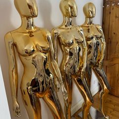 2 gold mannequins