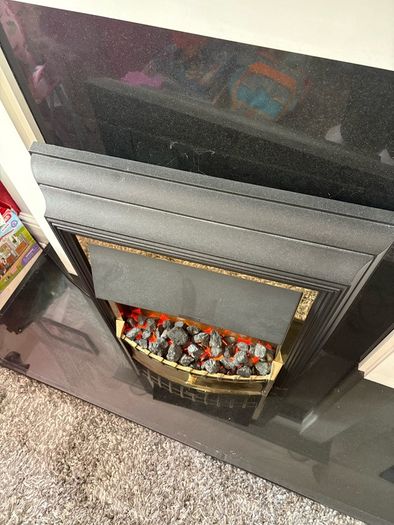 Fireplace with electric inset.