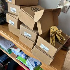 Nine sets of secondhand brass doors handles
