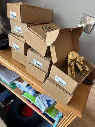 Nine sets of secondhand brass doors handles