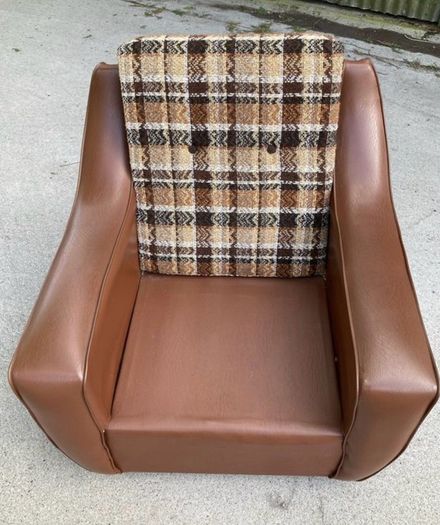 Vintage 1970s armchair on castors.