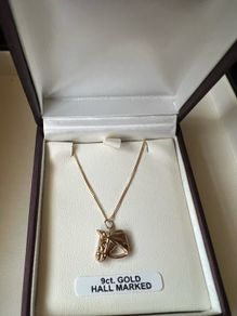gold horse head and chain