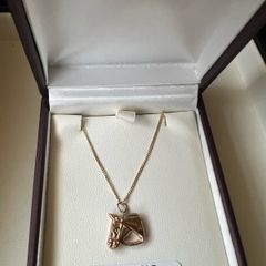 gold horse head and chain