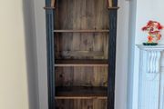 Tall black and wood bookcase