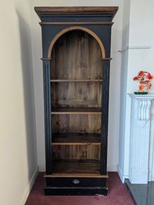 Tall black and wood bookcase