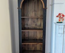 Tall black and wood bookcase