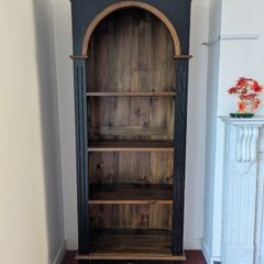 Tall black and wood bookcase