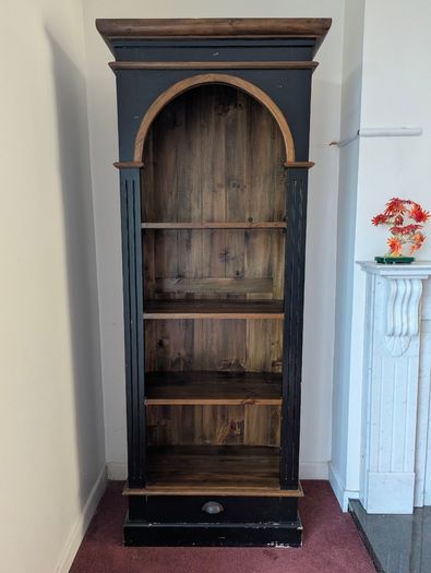 Tall black and wood bookcase
