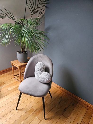 Grey velvet chair with black legs