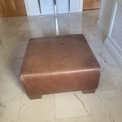 brown leather pouffe