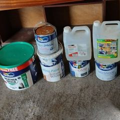 a selection of paint and a paint roller and some good paint brushes