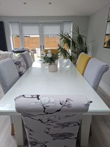 Glass topped dining room table 8 seater