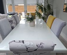 Glass topped dining room table 8 seater