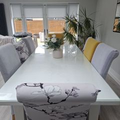 Glass topped dining room table 8 seater