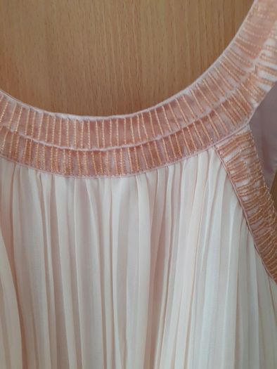 Occasional dress worn once and cleaned Slight emblishment on straps chest and waist .Slightly padded at bust so no need for a bra ..Knee length .25 euro paid 95 .