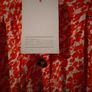 Asos Printed Crepe Midi Skirt features an orange ditsy floral print and a button down front. New with Tags Image 4