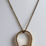 Vintage necklace features a polished, knocker-shaped pendant  gold plated, centered with an iridescent turquoise Spinning Fob Image 3