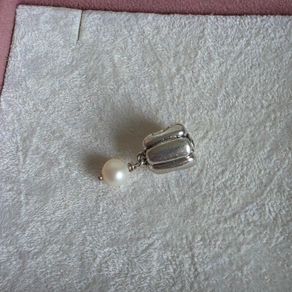 Pandora  charm with pearl drop and purple gemstone in great condition