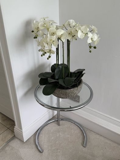 Adjustable chrome and glass side table
