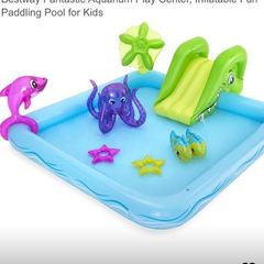 l large inflatable paddling pool , slide and sprinkler palm tree