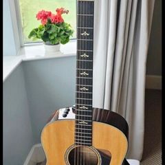 Taylor 618e  Grand Orchestra Spruce with Flamed Maple.