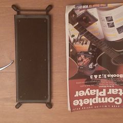 Guitar foot rest, beginners guitar book and guitar capo