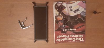 Guitar foot rest, beginners guitar book and guitar capo
