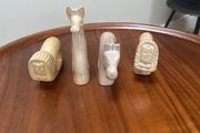 Four sandstone animal serviette holders or ornaments