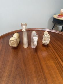 Four sandstone animal serviette holders or ornaments