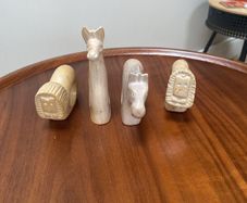 Four sandstone animal serviette holders or ornaments