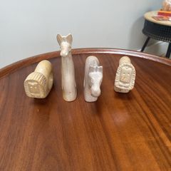 Four sandstone animal serviette holders or ornaments