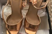 ladys shoes rose gold only wore once. Practically new.