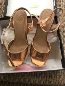 ladys shoes rose gold only wore once. Practically new.