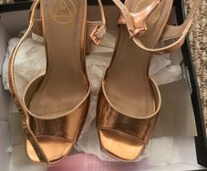 ladys shoes rose gold only wore once. Practically new.