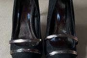 Black high heeled shoe with silver detail front