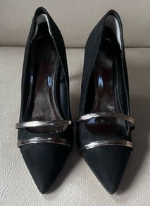 Black high heeled shoe with silver detail front