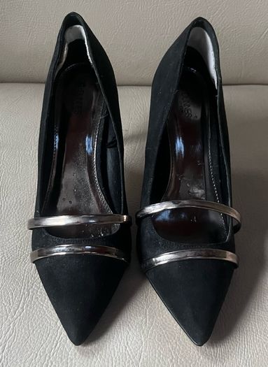 Black high heeled shoe with silver detail front